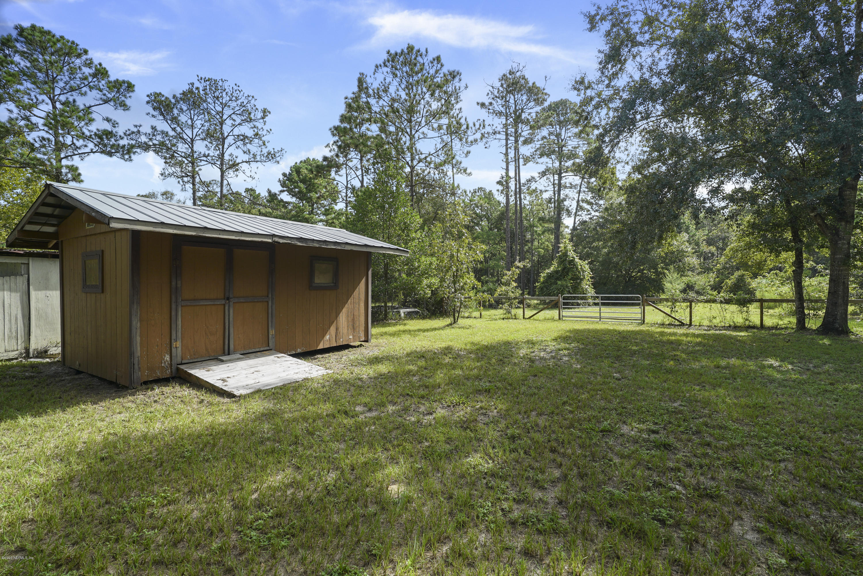 1435 Long Bay Road Middleburg, FL 32068 - Photo 3 of 27 a view of a backyard with large trees
