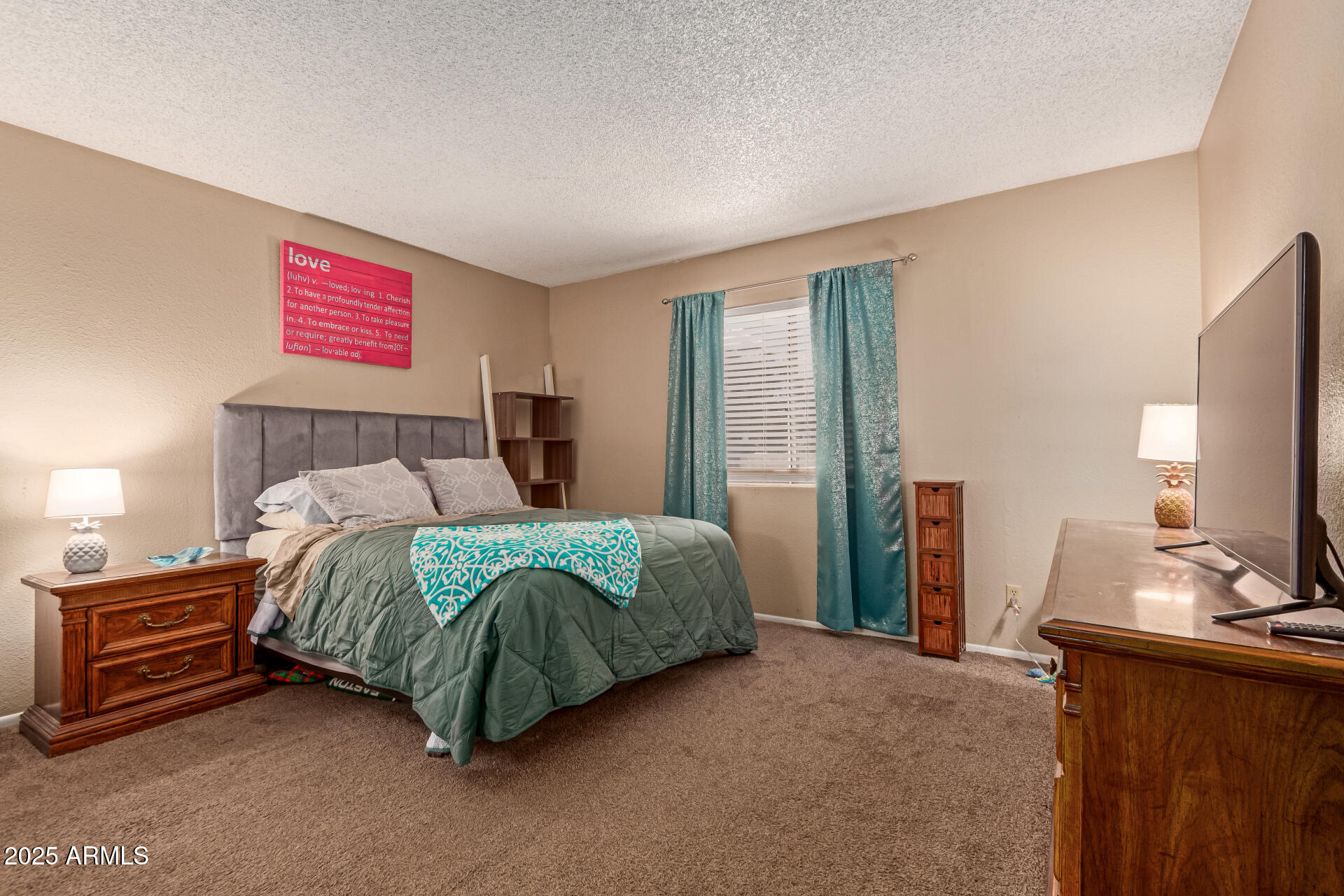 1051 South Dobson Road, Unit 138 Mesa, AZ 85202 - Photo 12 of 28 a bedroom with a bed and a flat screen tv