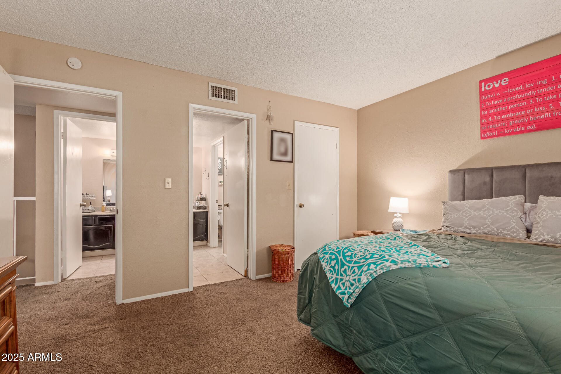 1051 South Dobson Road, Unit 138 Mesa, AZ 85202 - Photo 13 of 28 a bedroom with a bed and a view of bathroom