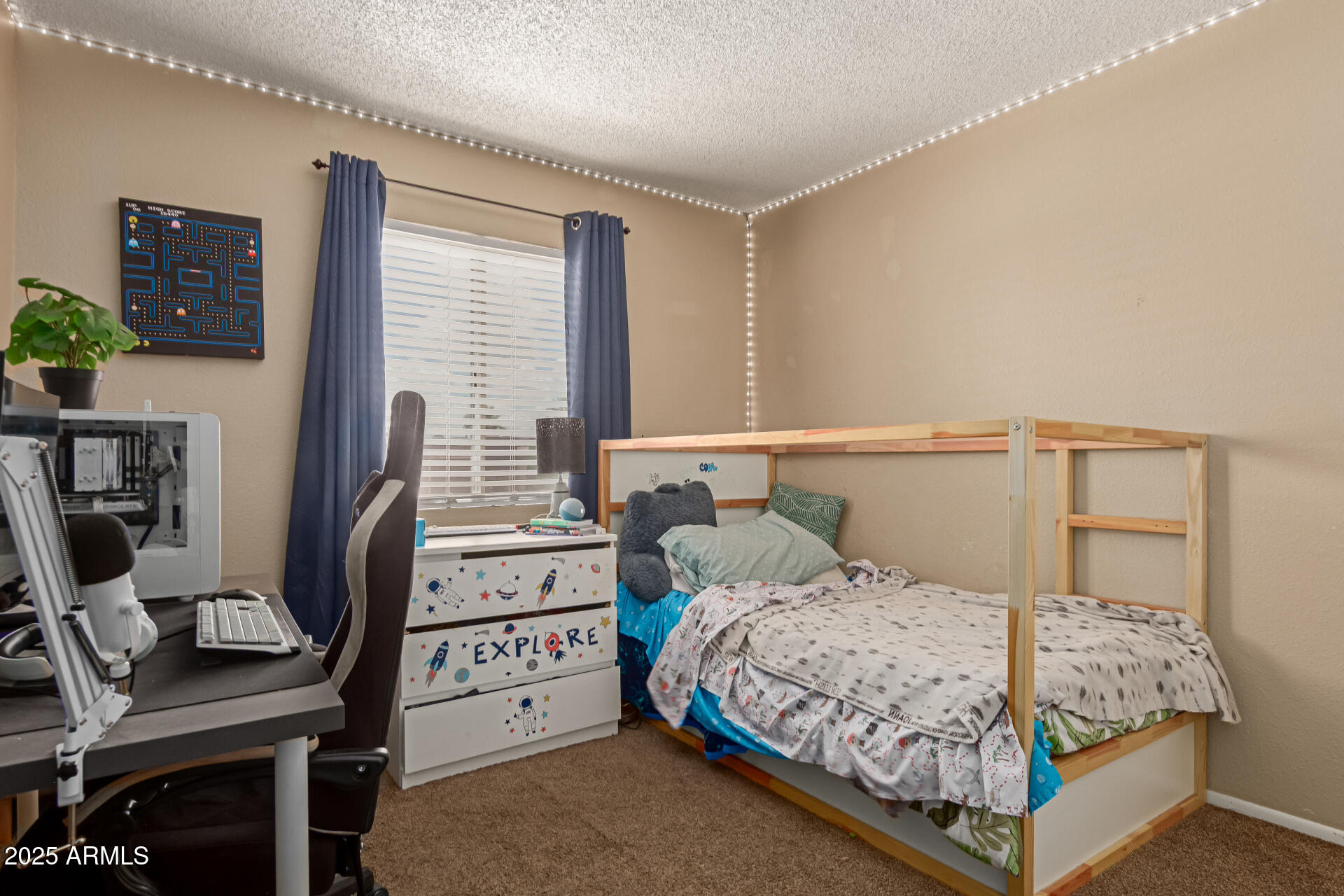 1051 South Dobson Road, Unit 138 Mesa, AZ 85202 - Photo 18 of 28 a bedroom with a bed and a flat tv screen on the dresser
