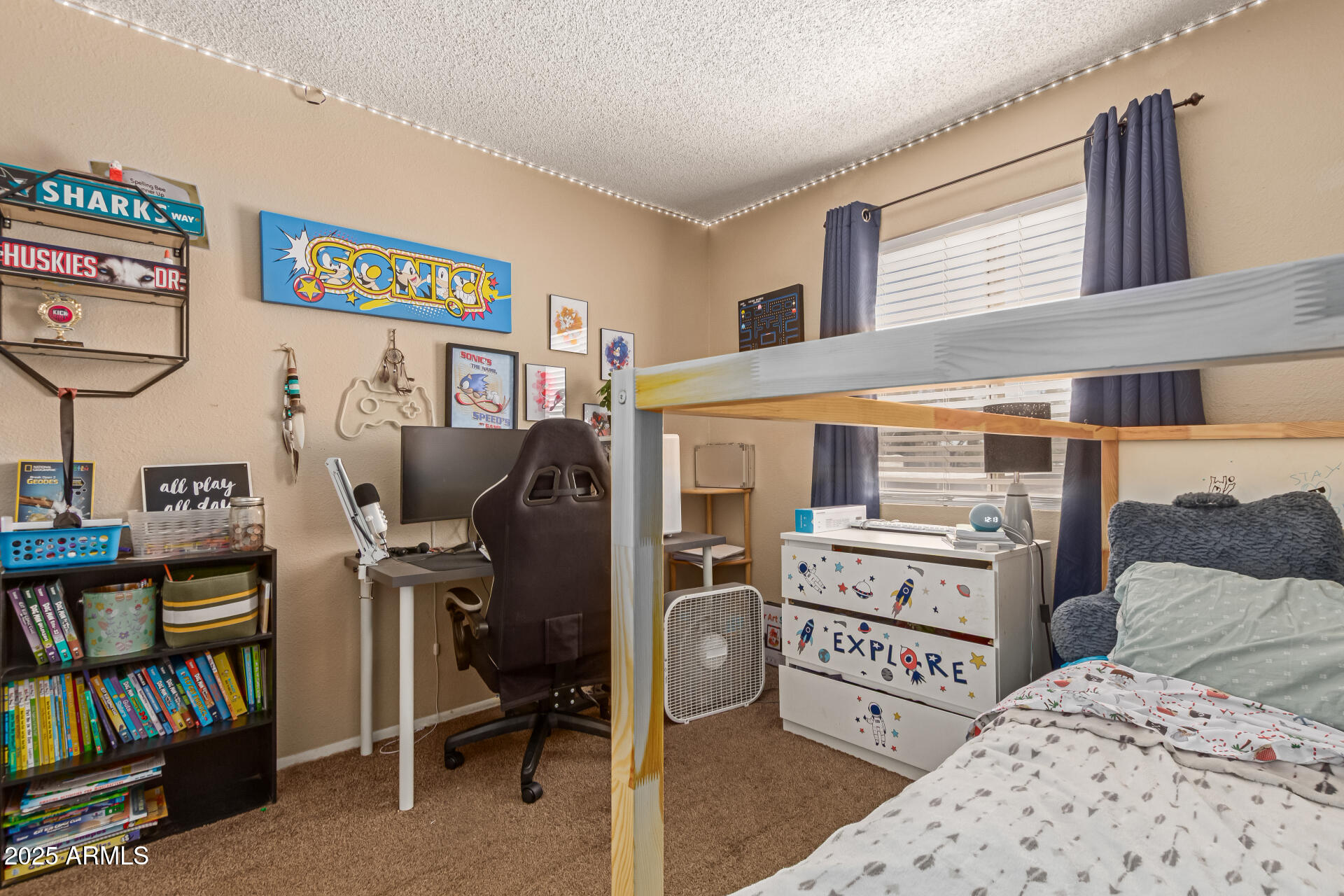 1051 South Dobson Road, Unit 138 Mesa, AZ 85202 - Photo 19 of 28 a bedroom with furniture and a book shelf