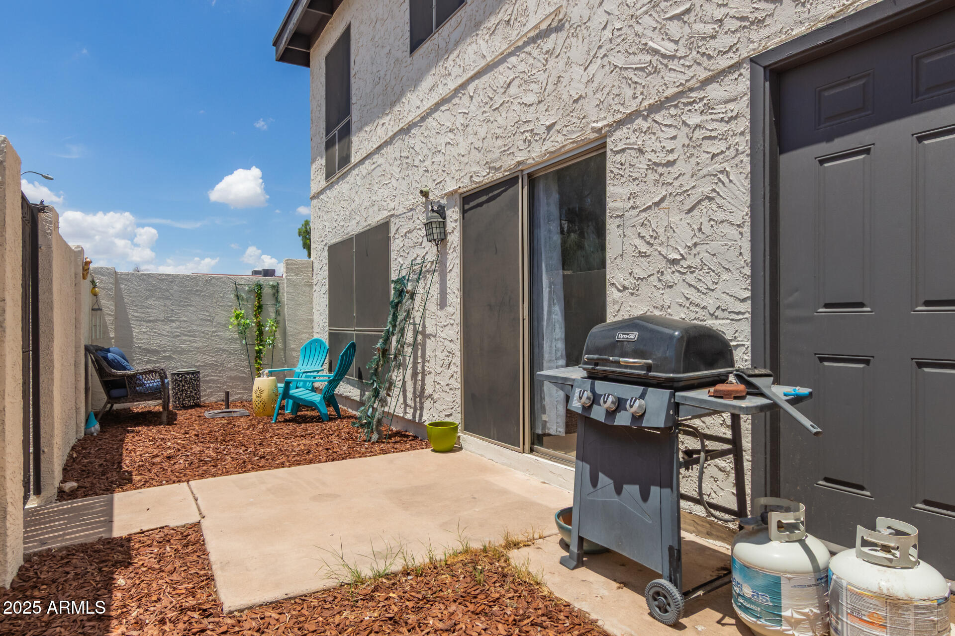 1051 South Dobson Road, Unit 138 Mesa, AZ 85202 - Photo 23 of 28 a living room with furniture a rug and a fireplace