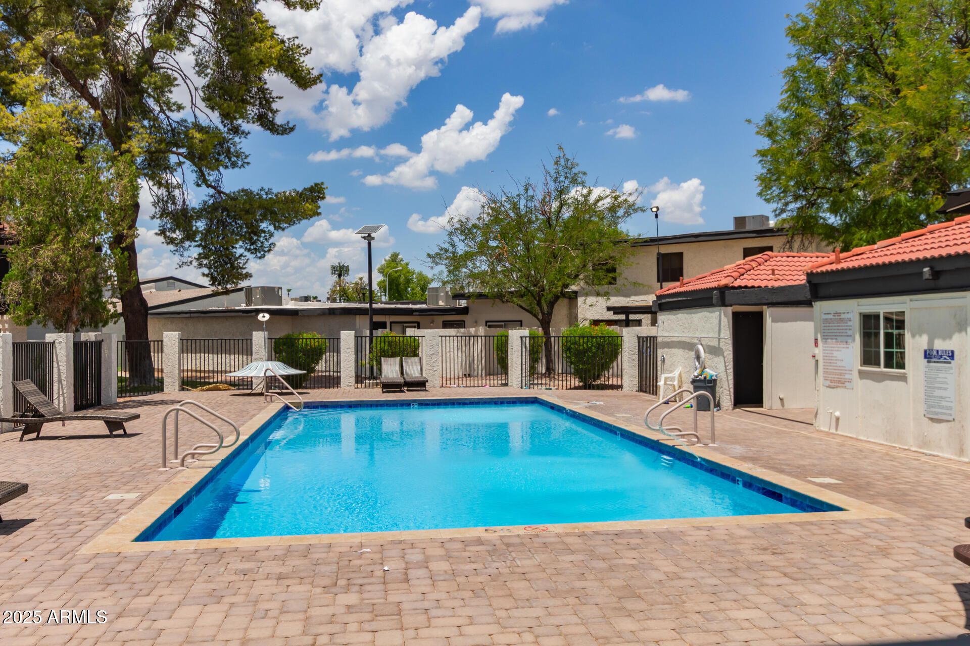 1051 South Dobson Road, Unit 138 Mesa, AZ 85202 - Photo 24 of 28 a view of a swimming pool with a patio