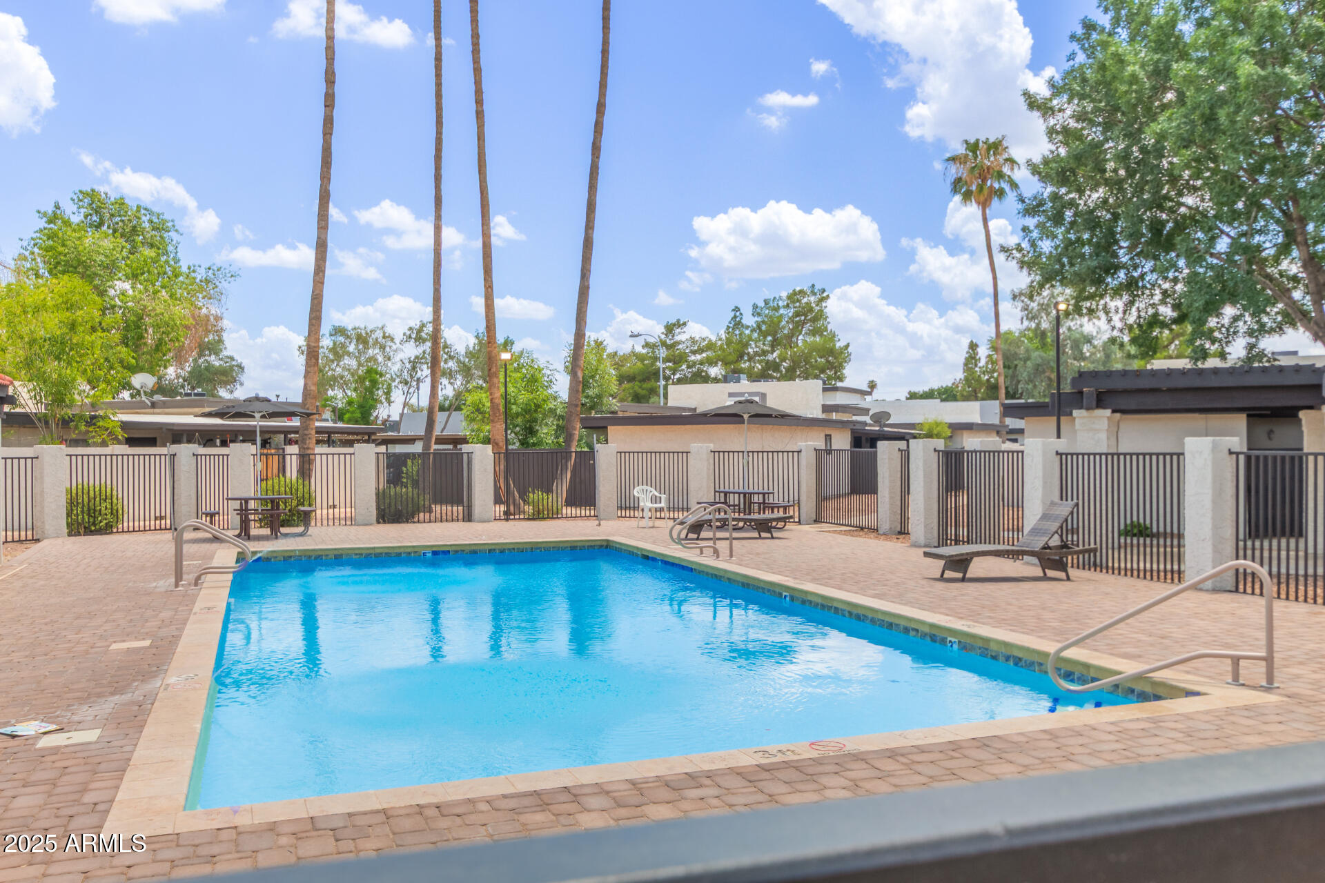 1051 South Dobson Road, Unit 138 Mesa, AZ 85202 - Photo 26 of 28 a view of a swimming pool with seating area