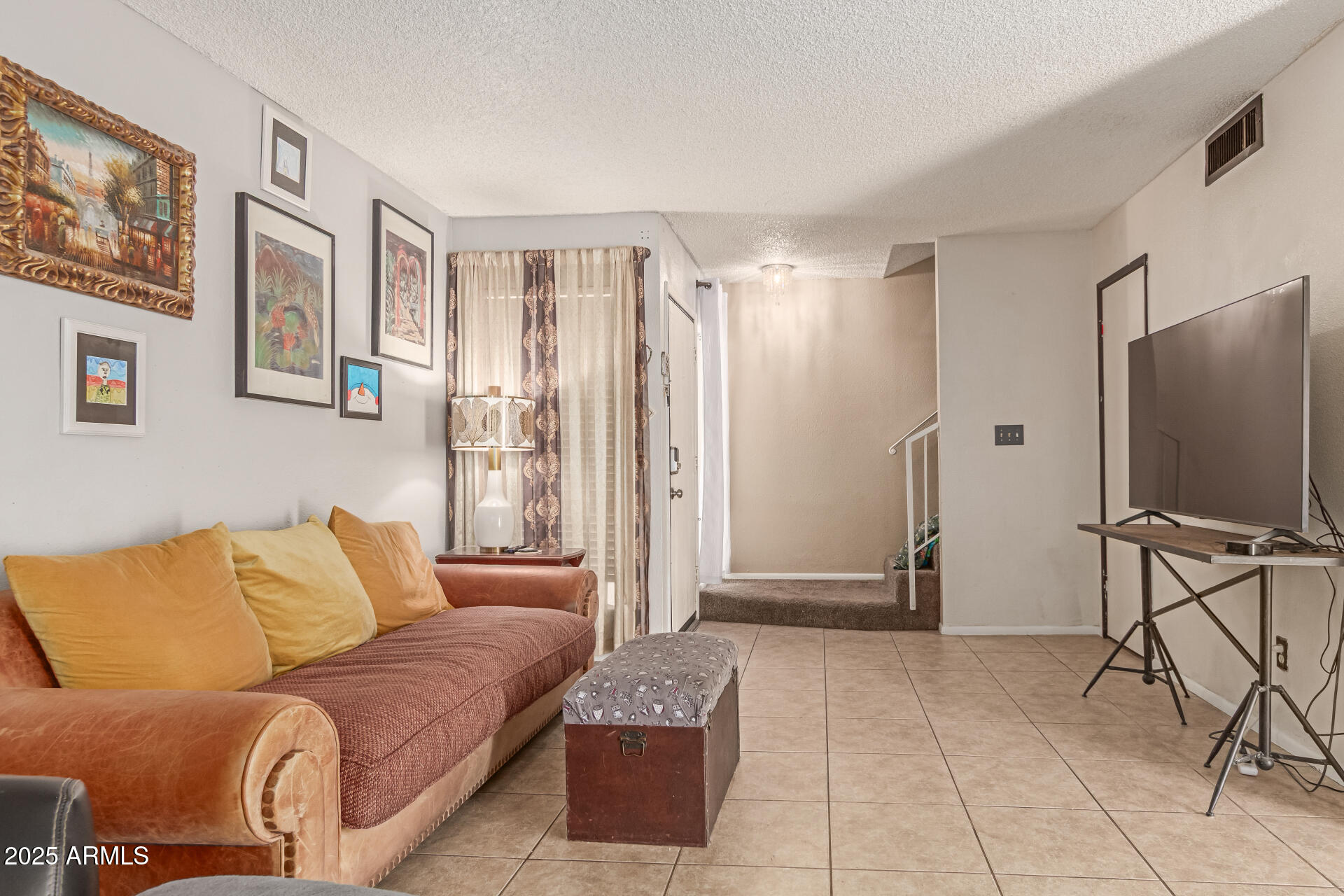 1051 South Dobson Road, Unit 138 Mesa, AZ 85202 - Photo 5 of 28 a living room with furniture and a flat screen tv
