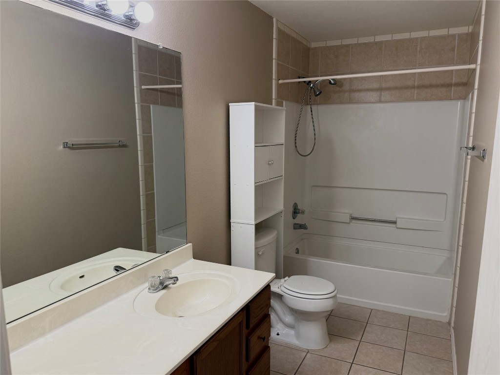 4403 Cisco Valley Drive Round Rock, TX 78664 - Photo 20 of 26 a bathroom with a granite countertop sink toilet and shower