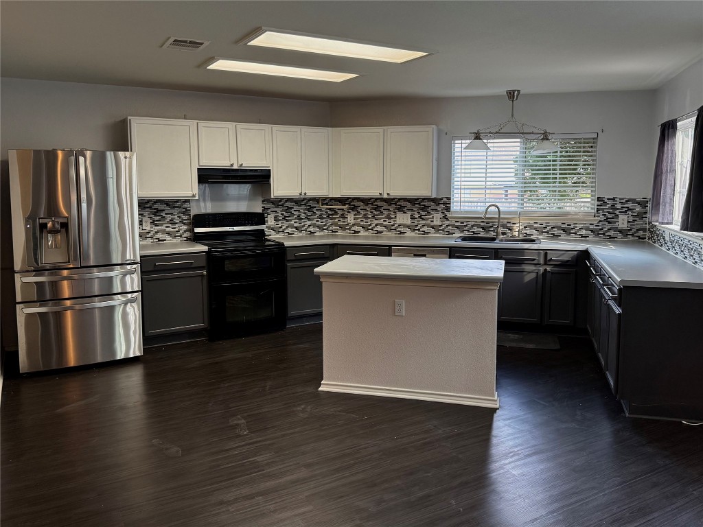 4403 Cisco Valley Drive Round Rock, TX 78664 - Photo 2 of 26 a kitchen with stainless steel appliances granite countertop a sink stove and refrigerator