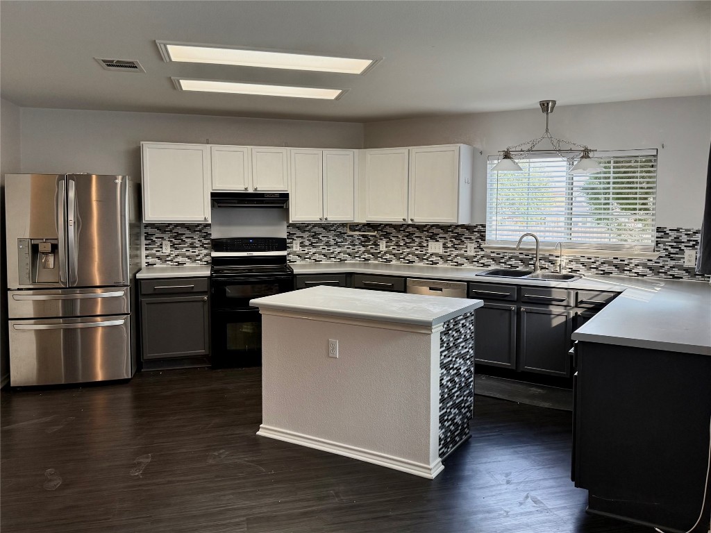 4403 Cisco Valley Drive Round Rock, TX 78664 - Photo 3 of 26 a kitchen with a sink stove and refrigerator