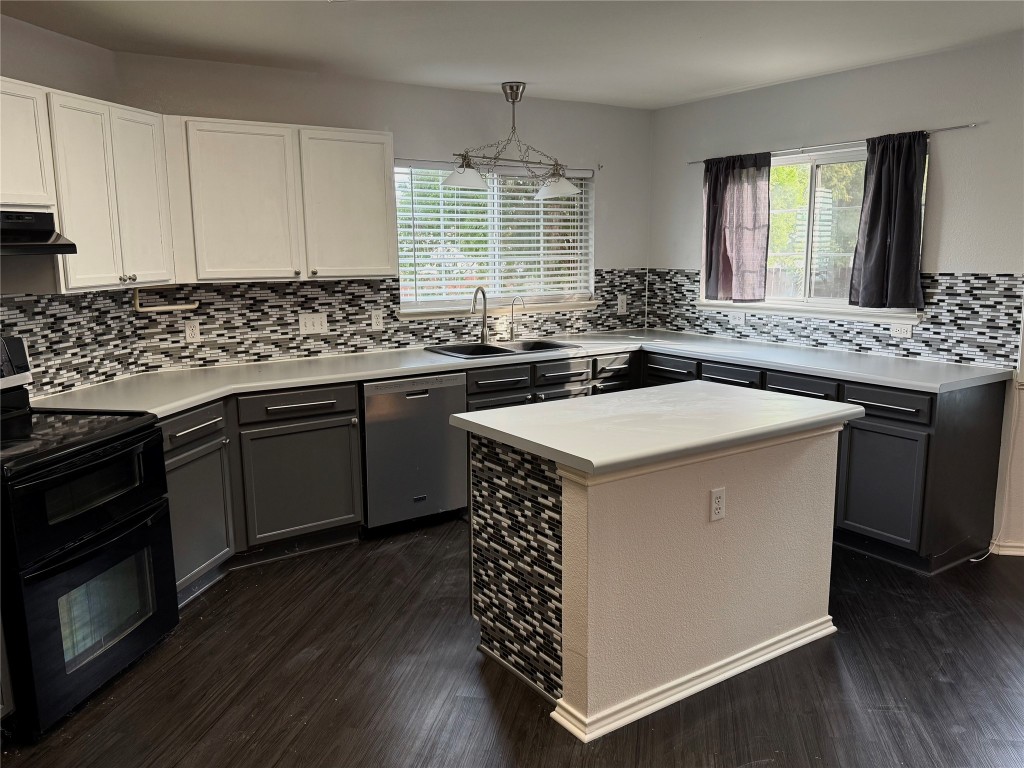 4403 Cisco Valley Drive Round Rock, TX 78664 - Photo 4 of 26 a kitchen with a sink stove and cabinets