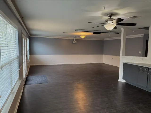 en empty room with wooden floor