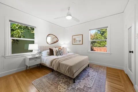 a bedroom with a bed and window