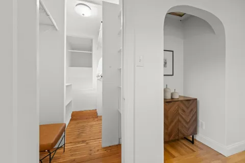 a view of hallway with stairs and a couch