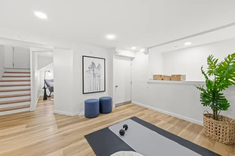 a living room with furniture and flowers