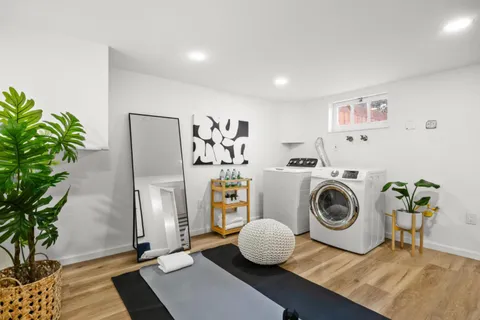 a kitchen with a refrigerator and a stove