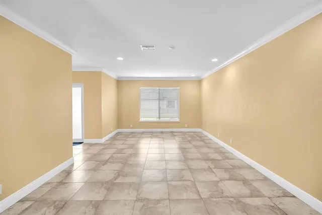 a view of an empty room and window