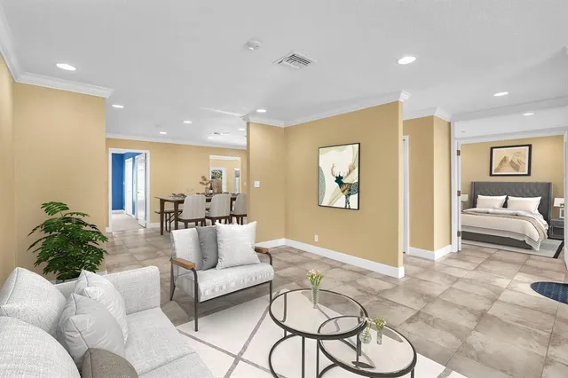 a living room with furniture or couch and a potted plant