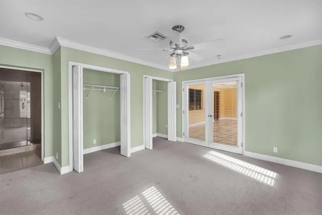 a view of a livingroom with a chandelier fan