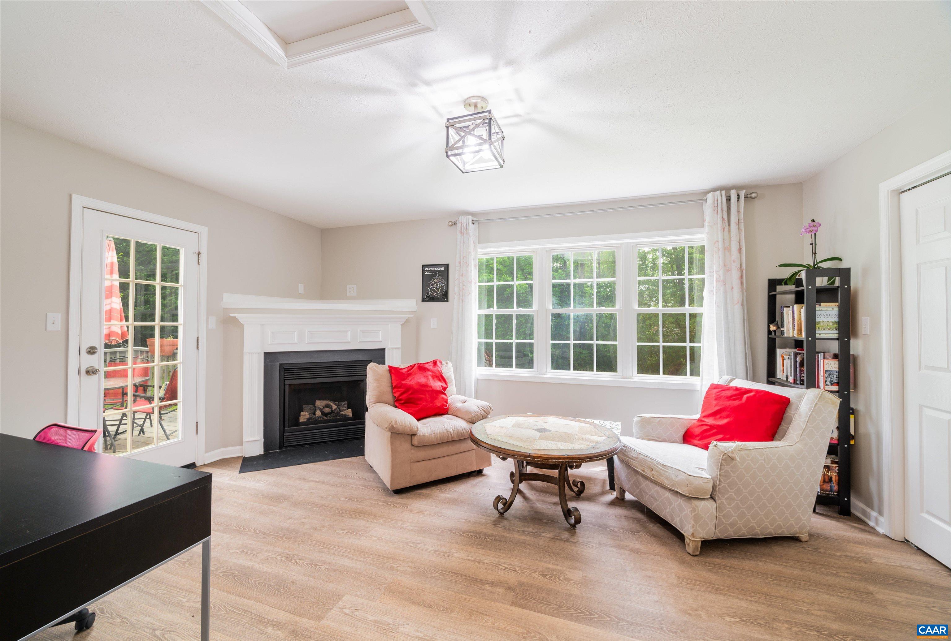 1507 Buck Road Crozet, VA 22932 - Photo 12 of 33 a living room with furniture and a fireplace