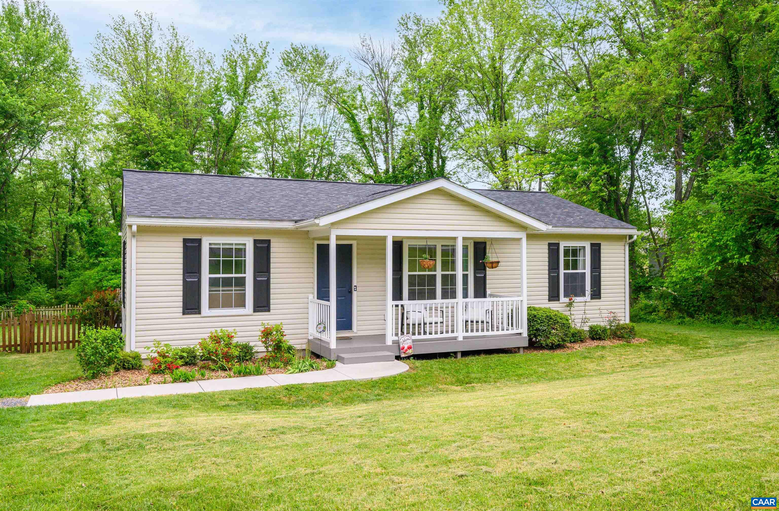 1507 Buck Road Crozet, VA 22932 - Photo 2 of 33 a front view of a house with a yard table and chairs