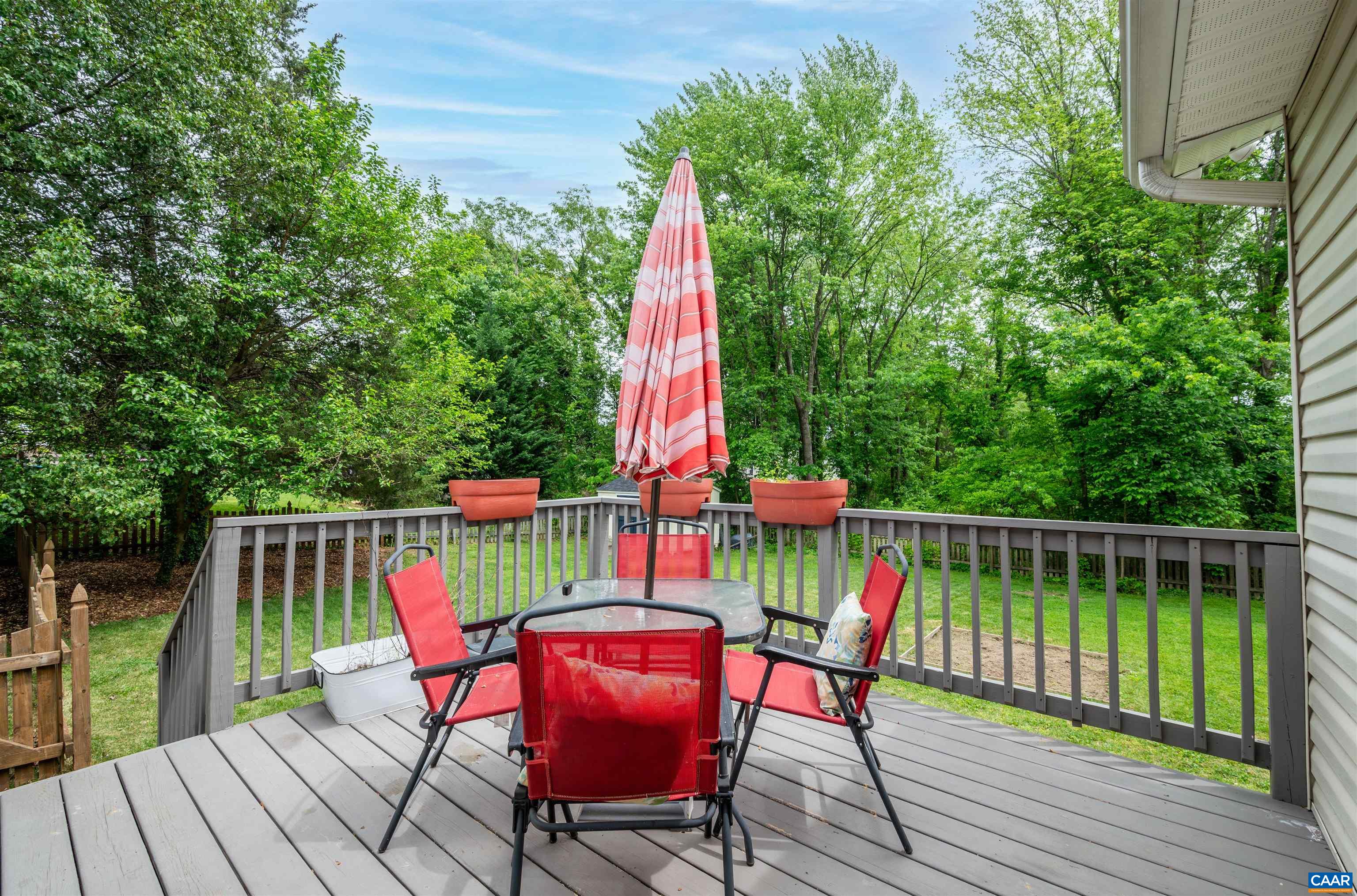 1507 Buck Road Crozet, VA 22932 - Photo 23 of 33 a view of a deck with chair and wooden floor