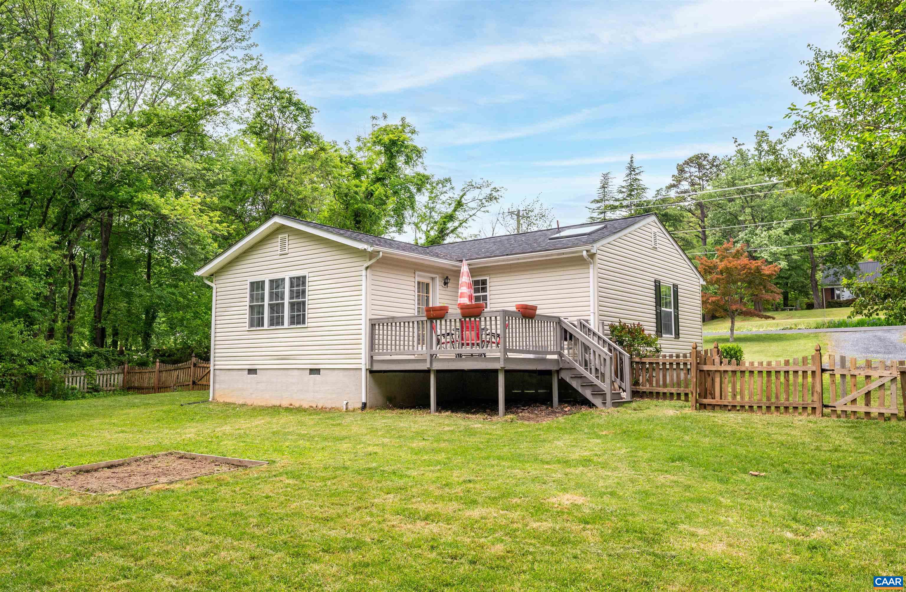 1507 Buck Road Crozet, VA 22932 - Photo 24 of 33 a view of a house with a yard and deck