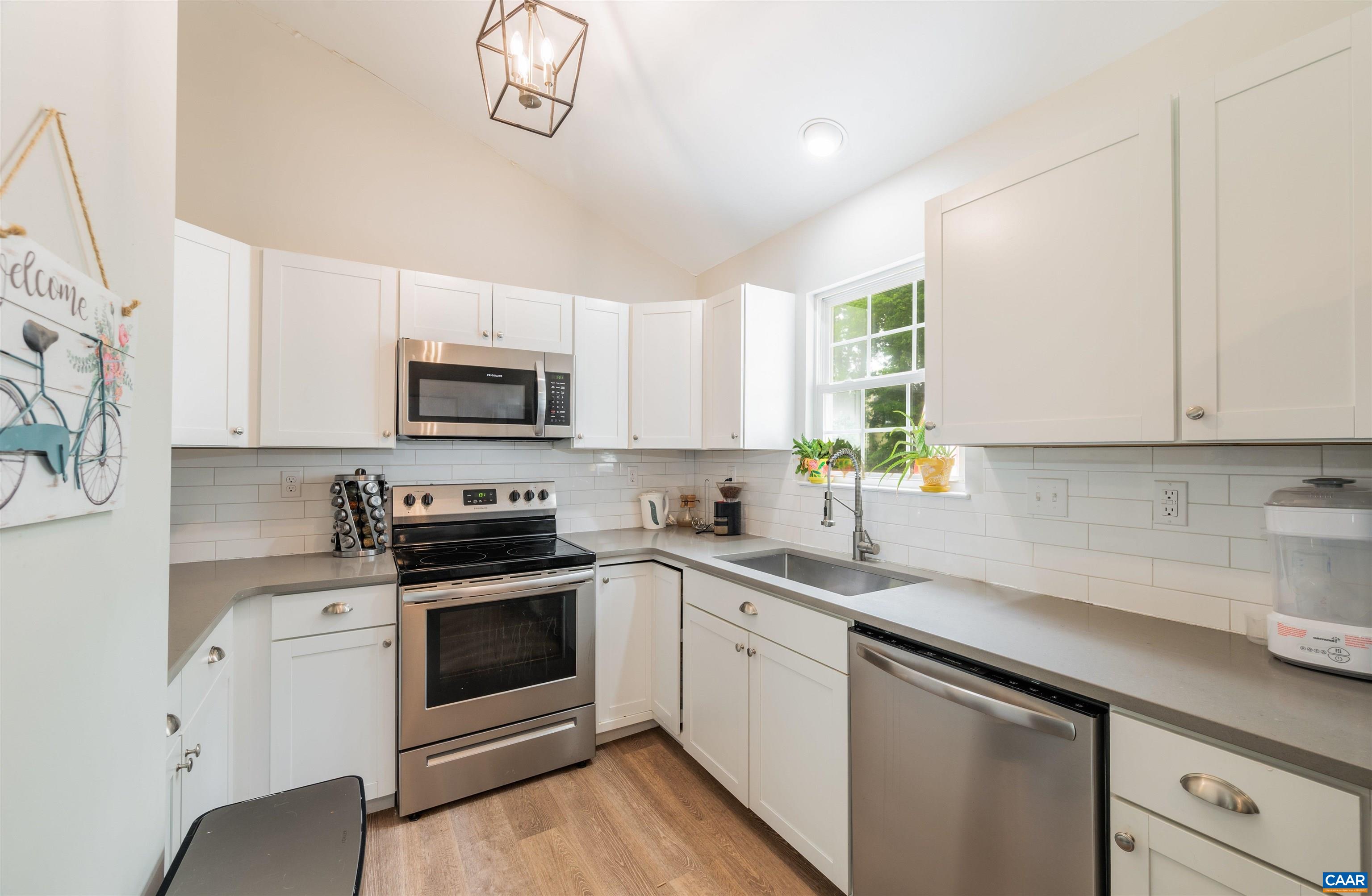 1507 Buck Road Crozet, VA 22932 - Photo 9 of 33 a kitchen with white cabinets stainless steel appliances and sink