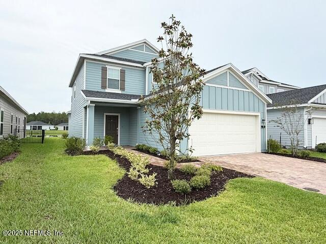 79 Beauclair Boulevard St. Augustine, FL 32084 - Photo 1 of 38 a front view of a house with a garden and yard