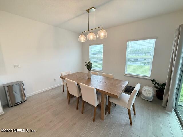 79 Beauclair Boulevard St. Augustine, FL 32084 - Photo 12 of 38 a view of a dining room with furniture window and wooden floor