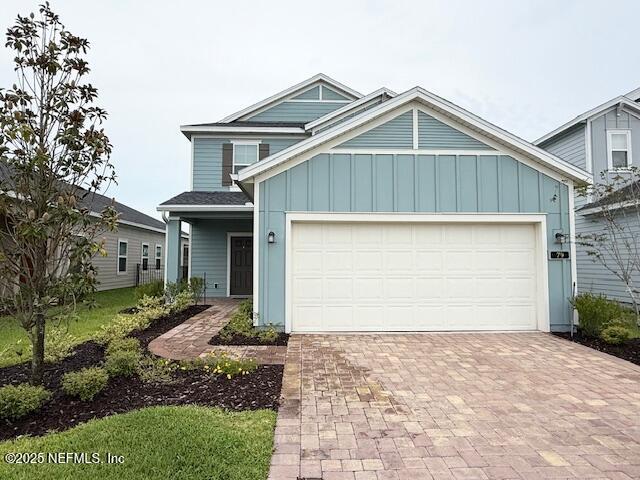 79 Beauclair Boulevard St. Augustine, FL 32084 - Photo 2 of 38 a front view of a house with a yard and garage