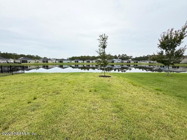 79 Beauclair Boulevard St. Augustine, FL 32084 - Photo 34 of 38 a view of a lake with houses in the back