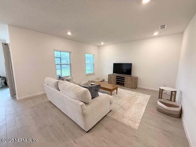 79 Beauclair Boulevard St. Augustine, FL 32084 - Photo 6 of 38 a living room with furniture and a flat screen tv