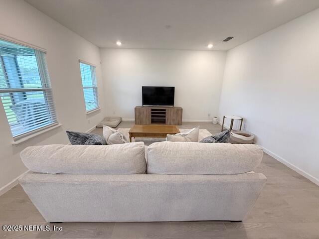 79 Beauclair Boulevard St. Augustine, FL 32084 - Photo 8 of 38 a living room with furniture and a flat screen tv
