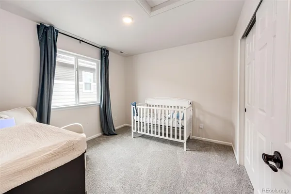 a room with a bed and a window
