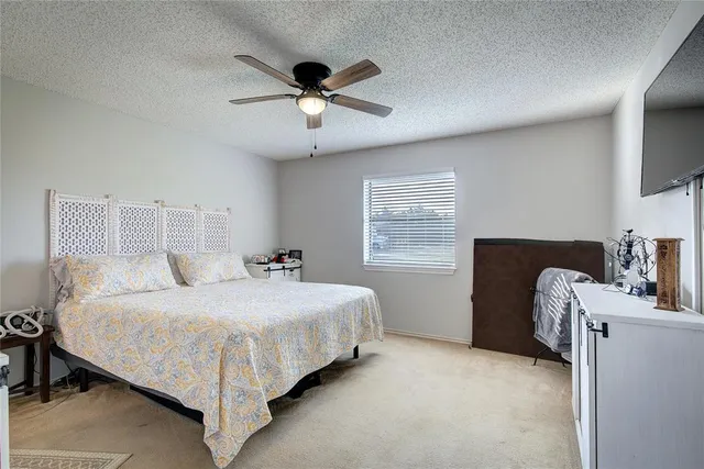 a kitchen with a stove a sink a dining table and chairs