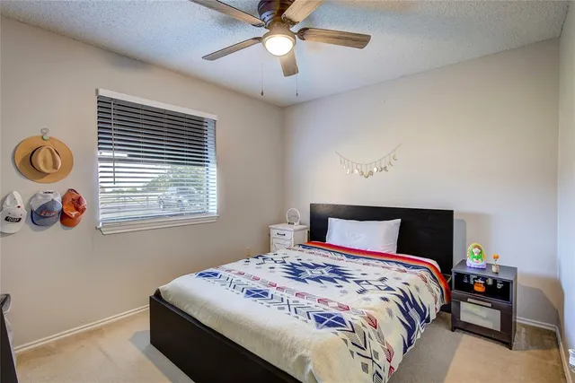a bathroom with a double vanity sink toilet and a mirror