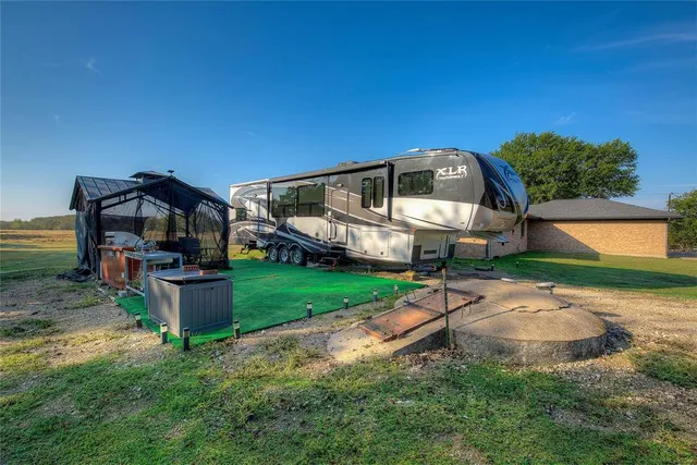 a view of a house with a back yard