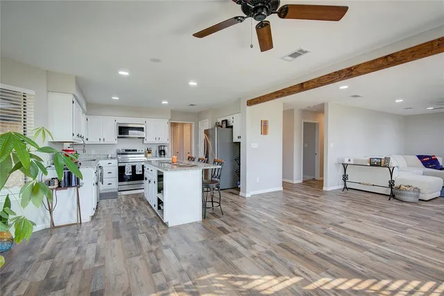 an aerial view of a house with outdoor space