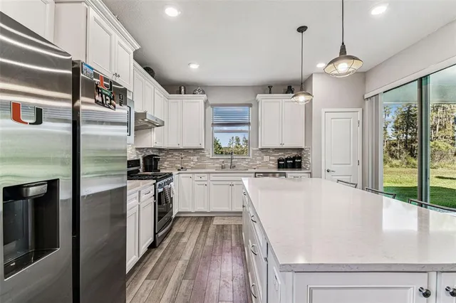 a kitchen with a sink and a microwave