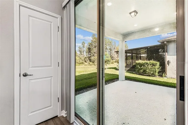 a view of walk in closet with clothes