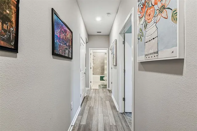 a view of a lake with houses in the back