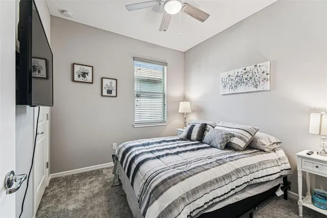 a house with green field in front of it