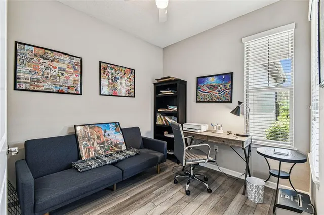 an aerial view of a city with lots of residential buildings and mountain view in back