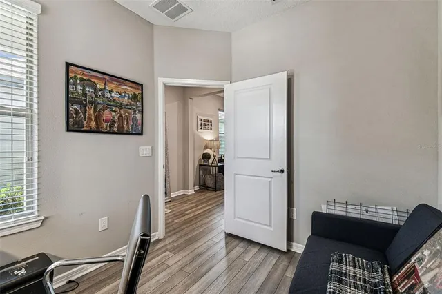 an aerial view of a house with a garden and lake view