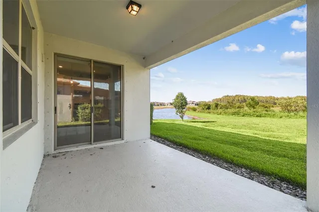 an aerial view of a house with a swimming pool yard and outdoor seating
