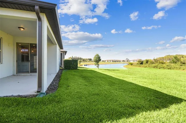 a living room with lots of furniture and a wooden floor