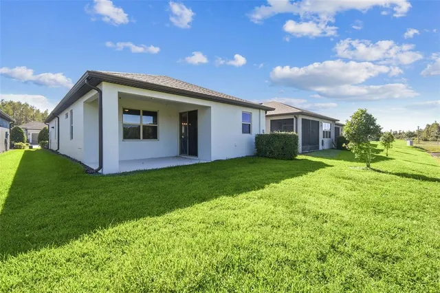 a living room with fireplace furniture and a flat screen tv