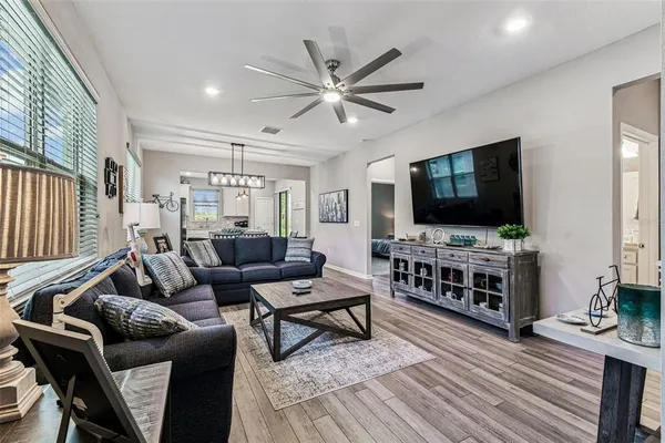 a living room with furniture and a large window