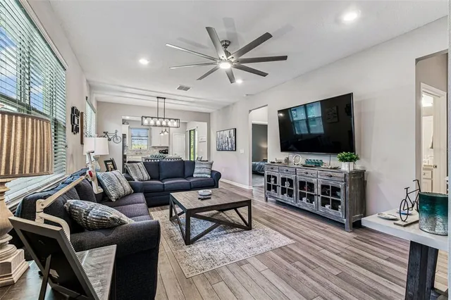 a living room with furniture and a large window