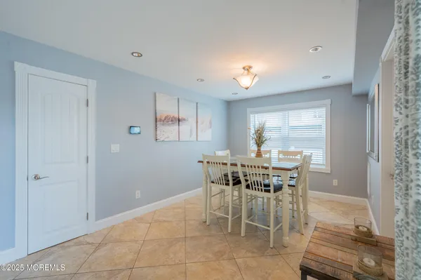 a kitchen with stainless steel appliances granite countertop a refrigerator sink and stove