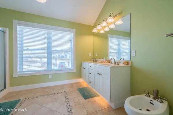a bathroom with a sink a vanity and a mirror